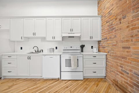 Suite, 1 Bedroom | Private kitchen | Full-size fridge, oven, stovetop, dishwasher