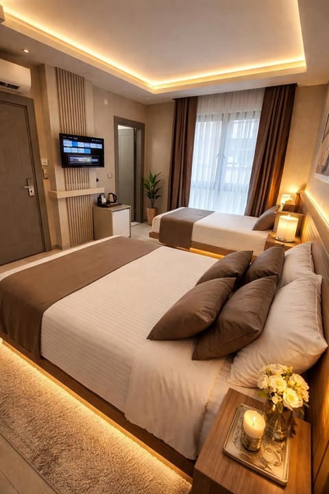 Family Triple Room, City View | Premium bedding, minibar, soundproofing, free WiFi