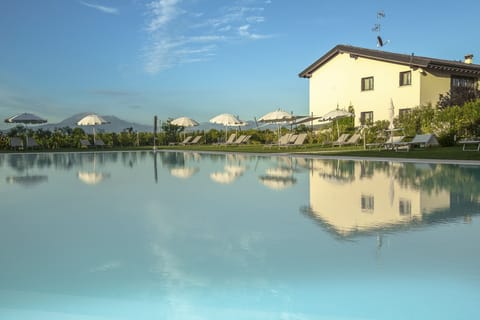 Seasonal outdoor pool, open 9:00 AM to 7:30 PM, pool umbrellas