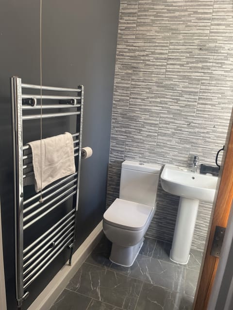 Deluxe Quadruple Room, Courtyard View | Bathroom | Shower, hair dryer, soap, shampoo