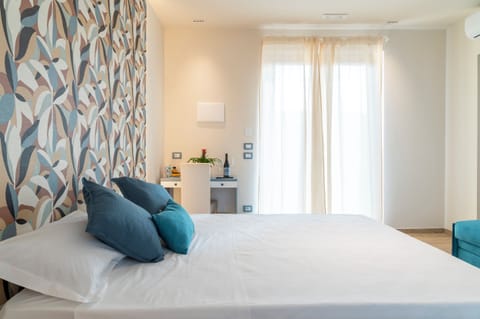 Deluxe Room, 1 Bedroom, Air conditioning, Pool View | Minibar, in-room safe, individually decorated, individually furnished