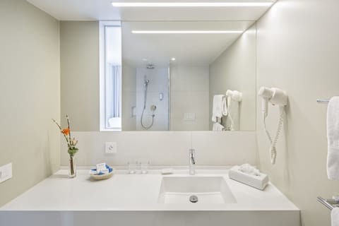 Shower, hair dryer, slippers, towels