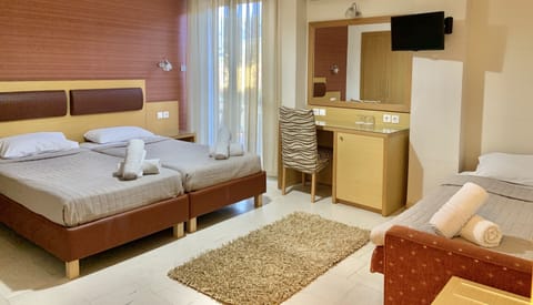 Triple Room | Iron/ironing board, free cribs/infant beds, free WiFi, bed sheets