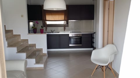 Deluxe Duplex, 2 Bedrooms | Private kitchen | Full-size fridge, oven, stovetop, coffee/tea maker