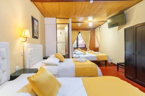 Family Triple Room, City View | Desk, laptop workspace, free WiFi