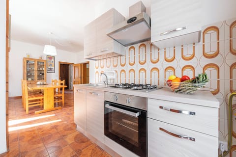 Apartment, 3 Bedrooms | Private kitchen | Full-size fridge, oven, stovetop, cookware/dishes/utensils