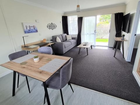 Executive Apartment, Patio, Garden View | Living area | TV