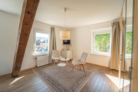 Comfort Double Room, City View | Living area | 24-inch Smart TV with cable channels