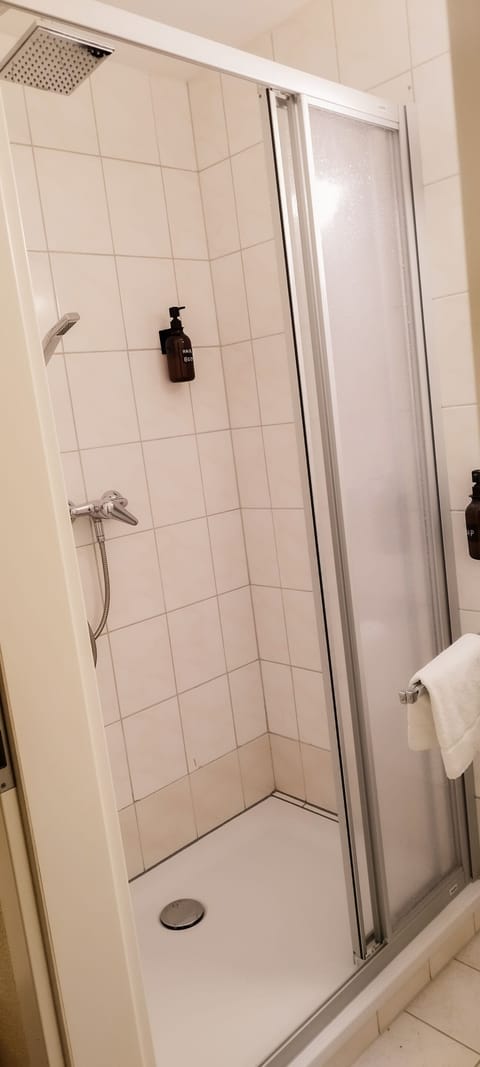 Double Room | Bathroom | Shower, hair dryer, towels, soap