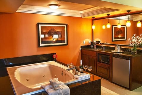 1 King Bed, Jetted Tub Suite | Blackout drapes, iron/ironing board, free WiFi, wheelchair access