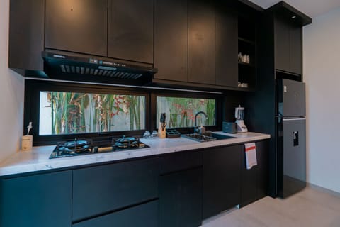 Family Triple Room, Balcony, Pool View | Private kitchen | Fridge, microwave, stovetop, cookware/dishes/utensils