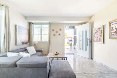 Townhome | Living area | 32-inch flat-screen TV with digital channels