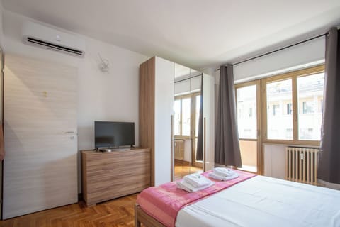 Desk, laptop workspace, blackout drapes, iron/ironing board