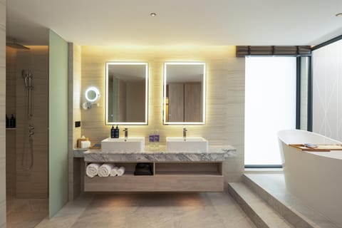 Suite, Balcony, Oceanfront | Bathroom | Free toiletries, hair dryer, bathrobes, slippers