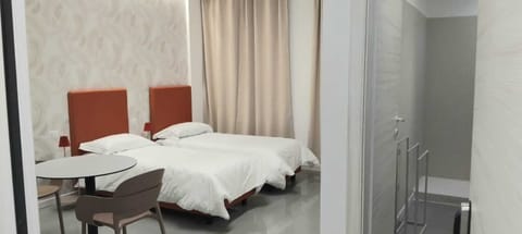 Double or Twin Room, Kitchenette | In-room safe, blackout drapes, free WiFi