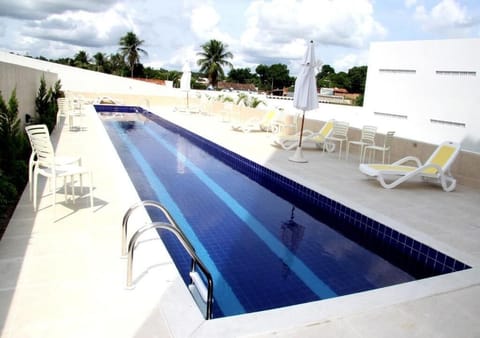 Outdoor pool, open 8:00 AM to 11:00 PM, sun loungers