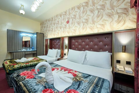 Family Room, City View | Desk, laptop workspace, iron/ironing board, free WiFi