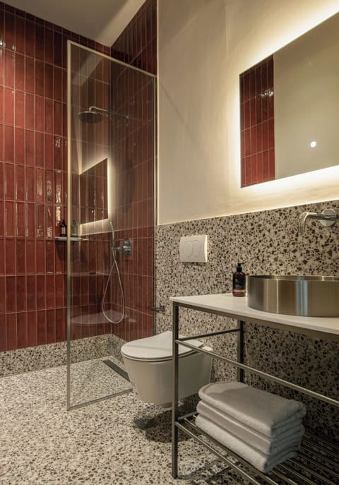 Family Suite, Balcony, City View | Bathroom | Combined shower/tub, hair dryer, slippers, towels