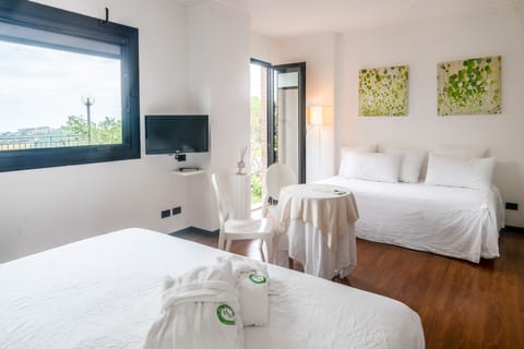 Junior Triple Room, 2 Bathrooms, Hill View | Premium bedding, minibar, in-room safe, desk