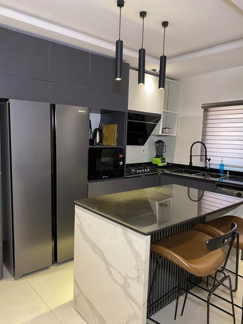 Apartment, 3 Bedrooms, Balcony | Private kitchen | Microwave, oven, stovetop, cookware/dishes/utensils
