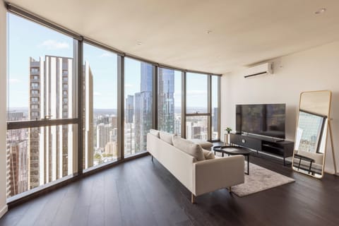 Luxury Apartment, City View | Living area | Flat-screen TV
