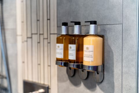 Shower, rainfall showerhead, designer toiletries, hair dryer