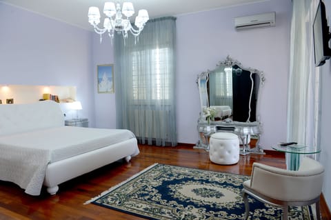 Deluxe Suite, 1 King Bed, Ensuite, Pool View | Premium bedding, minibar, individually decorated, soundproofing