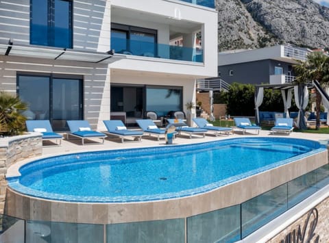 2 outdoor pools, pool umbrellas, sun loungers