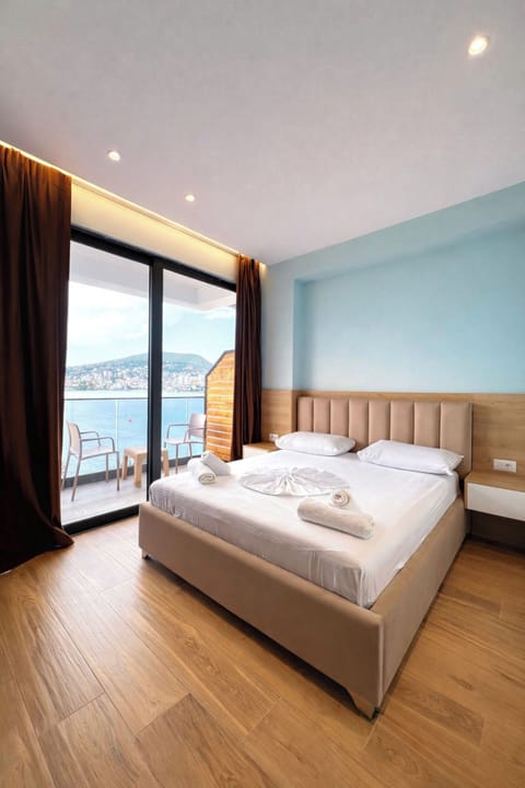 Double Room, Balcony, Sea View | Iron/ironing board, bed sheets