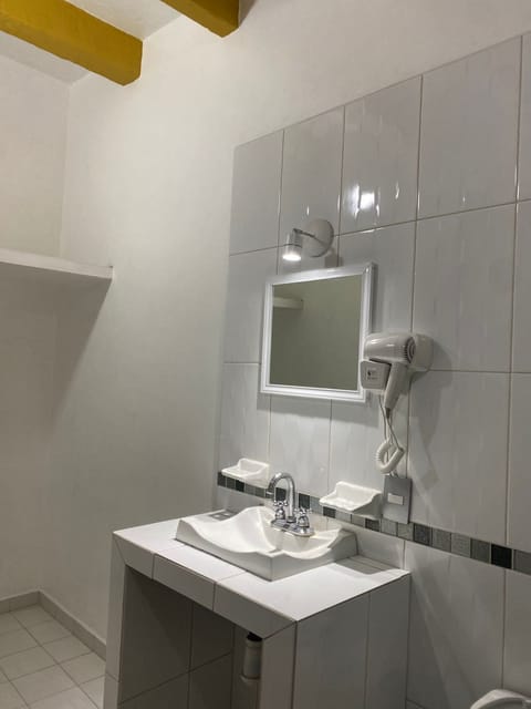 Family Triple Room | Bathroom | Shower, hair dryer, towels, soap