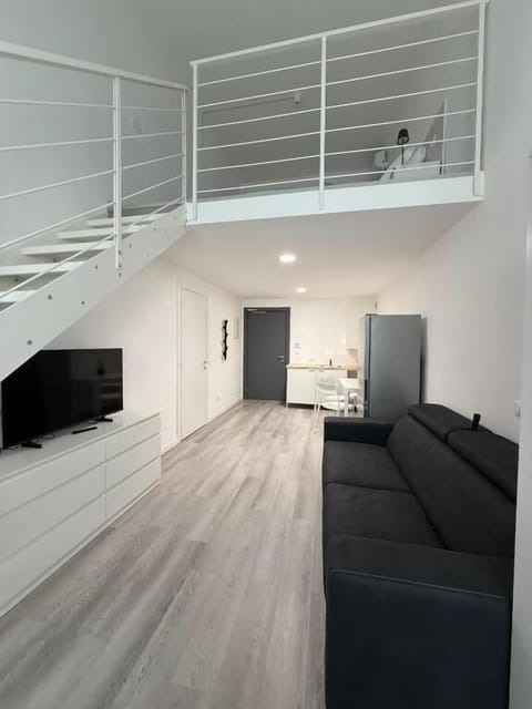 Deluxe Apartment | Living area | TV