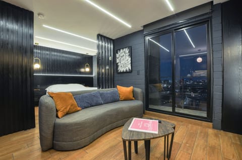 City Studio, Balcony, City View | Living area | 60-inch Smart TV with digital channels, streaming services
