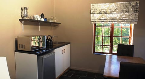 De Luxe 2 Bedroom Family Suite with own lounge, balcony and fireplace (2nd bedroom for kids u/12) | Private kitchenette | Mini-fridge, microwave, coffee/tea maker, electric kettle