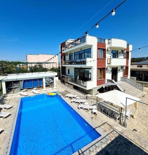 Seasonal outdoor pool, open 8:00 AM to 10:00 PM, pool umbrellas