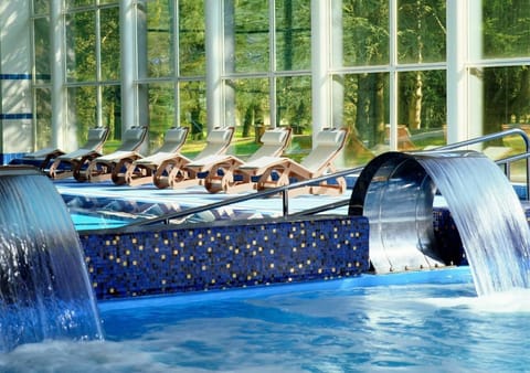 3 indoor pools, outdoor pool, open 10 AM to 7 PM, pool umbrellas