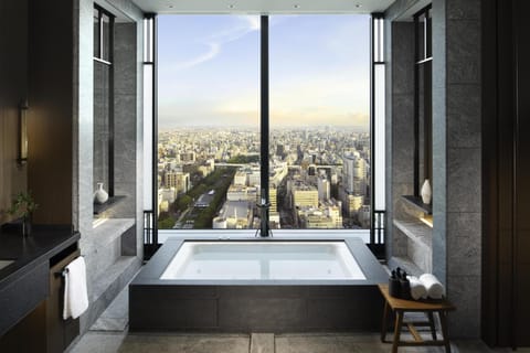 Suite, 1 King Bed (Conrad) | Bathroom | Separate tub and shower, free toiletries, hair dryer, bathrobes