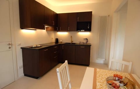 Classic Apartment, Balcony, Tower | Private kitchen | Espresso maker, coffee/tea maker, electric kettle, dining tables