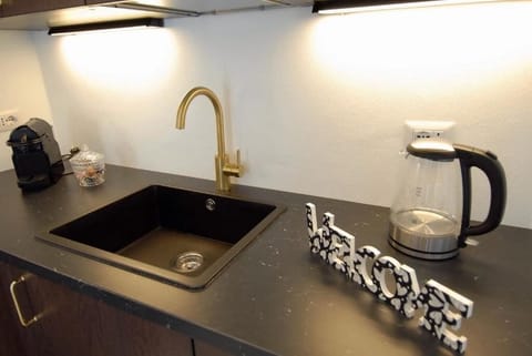 Classic Apartment, Balcony, Tower | Private kitchen | Espresso maker, coffee/tea maker, electric kettle, dining tables