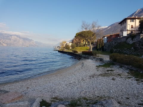 Beach nearby, white sand, sun loungers