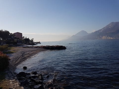 Beach nearby, white sand, sun loungers