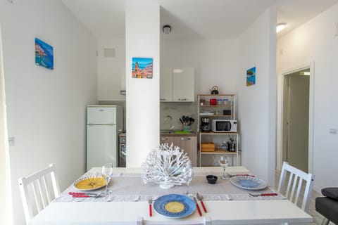 Apartment, Sea View | Private kitchen | Fridge, microwave, oven, stovetop