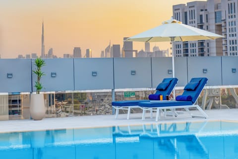 Outdoor pool, open 8:00 AM to 8:00 PM, pool umbrellas, sun loungers
