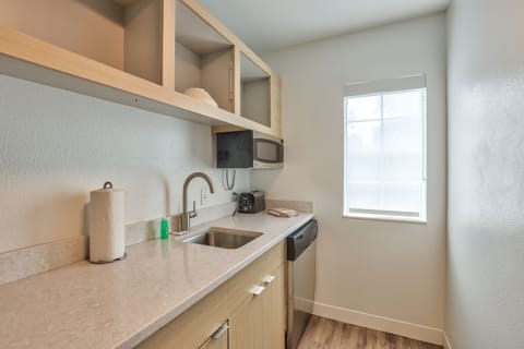 Suite, 2 Bedrooms | Private kitchen | Fridge, microwave, stovetop, dishwasher