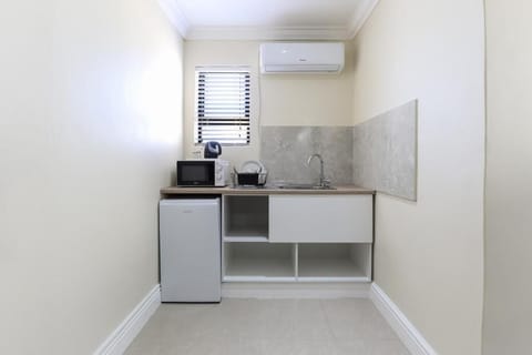 Mini-fridge, microwave, cookware/dishes/utensils