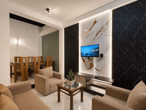 Deluxe Apartment, 3 Bedrooms, 2 Bathrooms, Ground Floor | Living area | 32-inch LED TV with digital channels