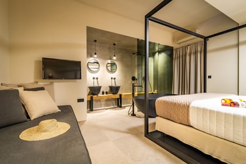 Junior Suite, Bathtub | In-room safe, free WiFi, bed sheets