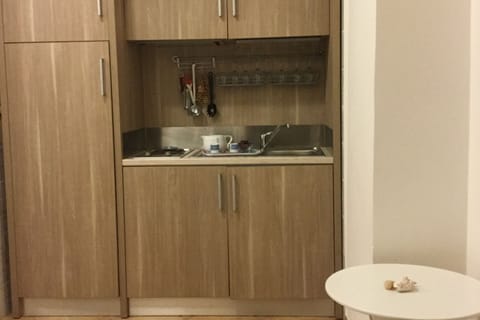 Fridge, stovetop, coffee/tea maker, cookware/dishes/utensils