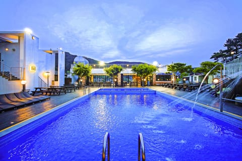 Seasonal outdoor pool, open 6:00 AM to 9:00 PM, pool umbrellas