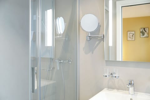 Junior Studio Suite, Air conditioning, City View | Bathroom | Shower, free toiletries, hair dryer, towels