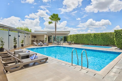 Outdoor pool, pool umbrellas, sun loungers